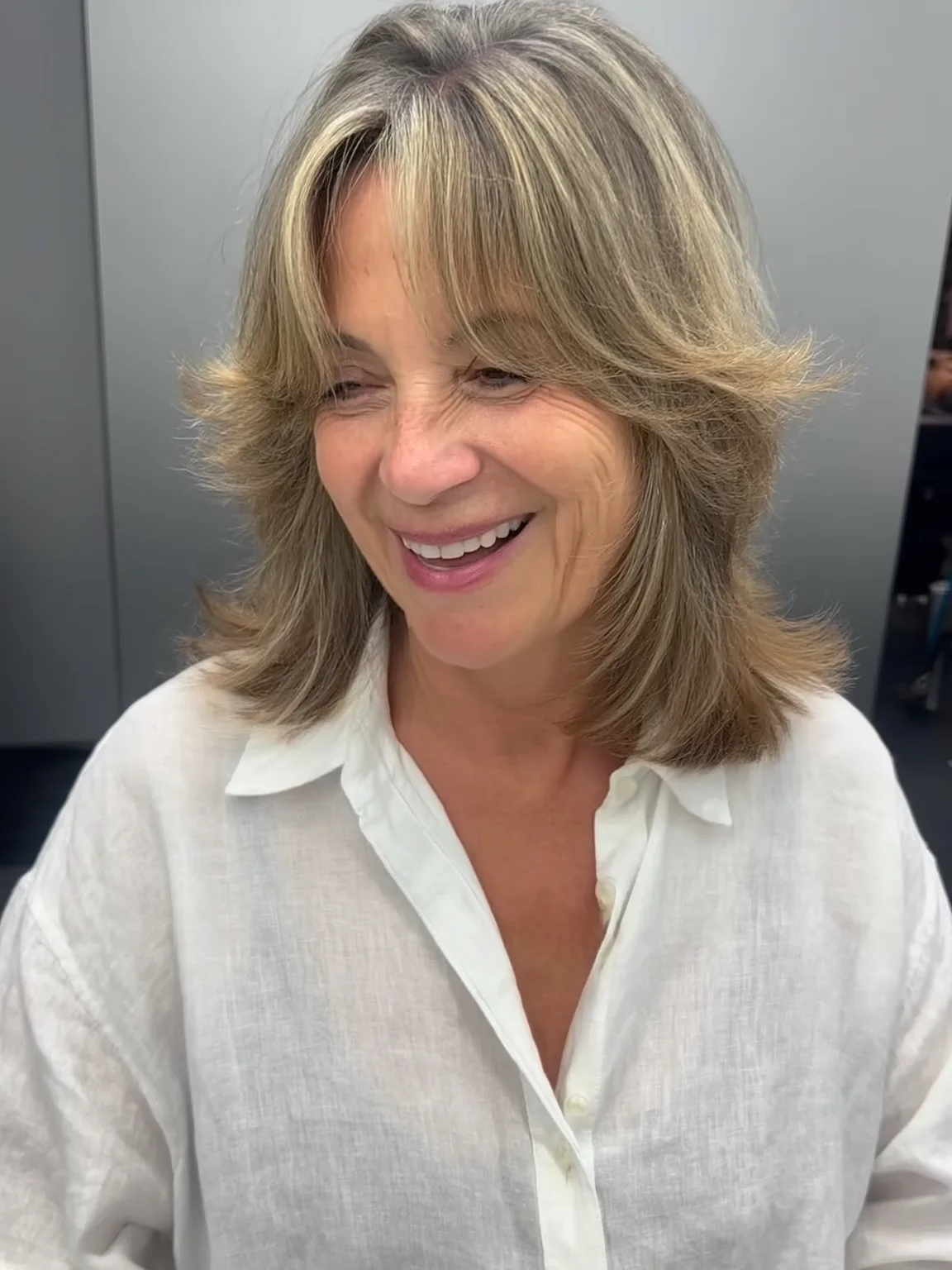 Shoulder-Length Layered Bob with Ash Blonde Highlights
